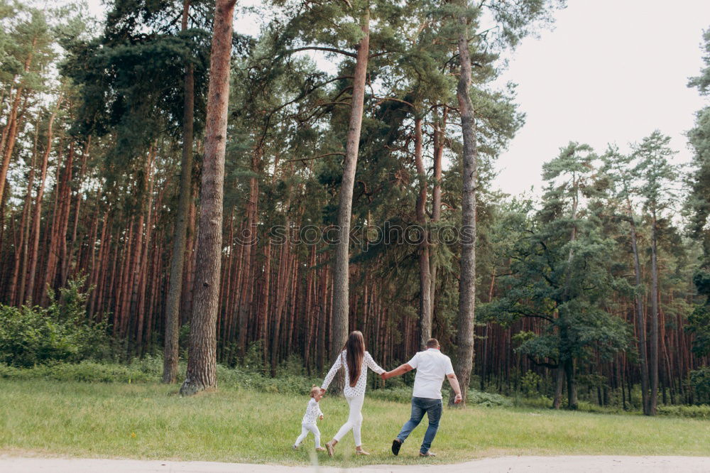 Similar – Elferly fit happy couple hiking through forest together on vacation