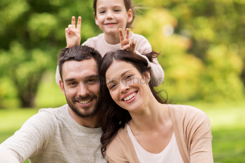 Similar – Image, Stock Photo Happy young family in a urban park.