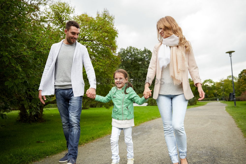 Similar – Image, Stock Photo Portrait of happy family enjoying together leisure over a wooden pathway into the forest