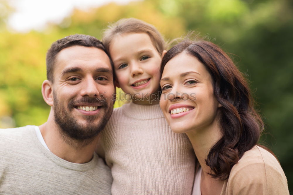 Image, Stock Photo Happy young family in a urban park.