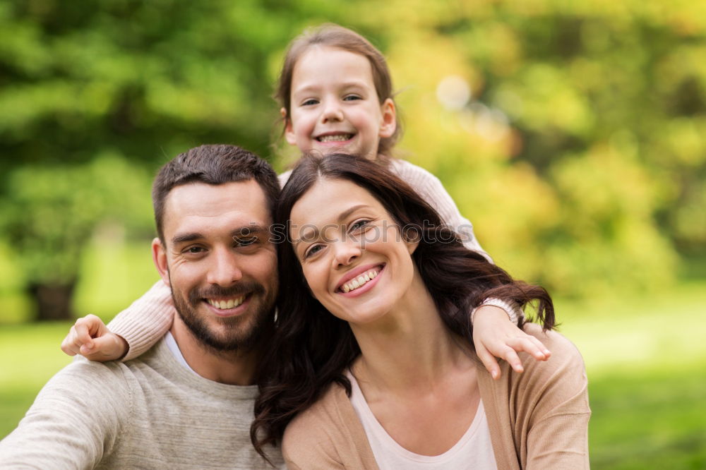 Similar – Image, Stock Photo Happy young family in a urban park.