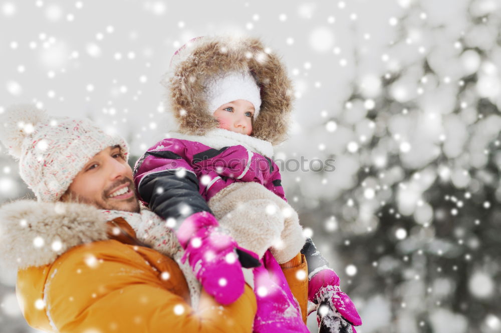 Similar – Mother is playing with her little daughter outdoors in winter