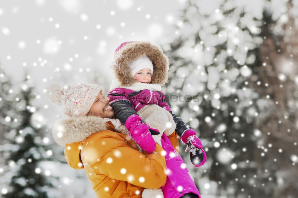 Similar – Image, Stock Photo Mother is playing with her little daughter outdoors on wintery day. Woman is throwing snow on her child. Family spending time together enjoying wintertime. Woman is wearing red coat and wool cap, toddler is wearing dark blue snowsuit