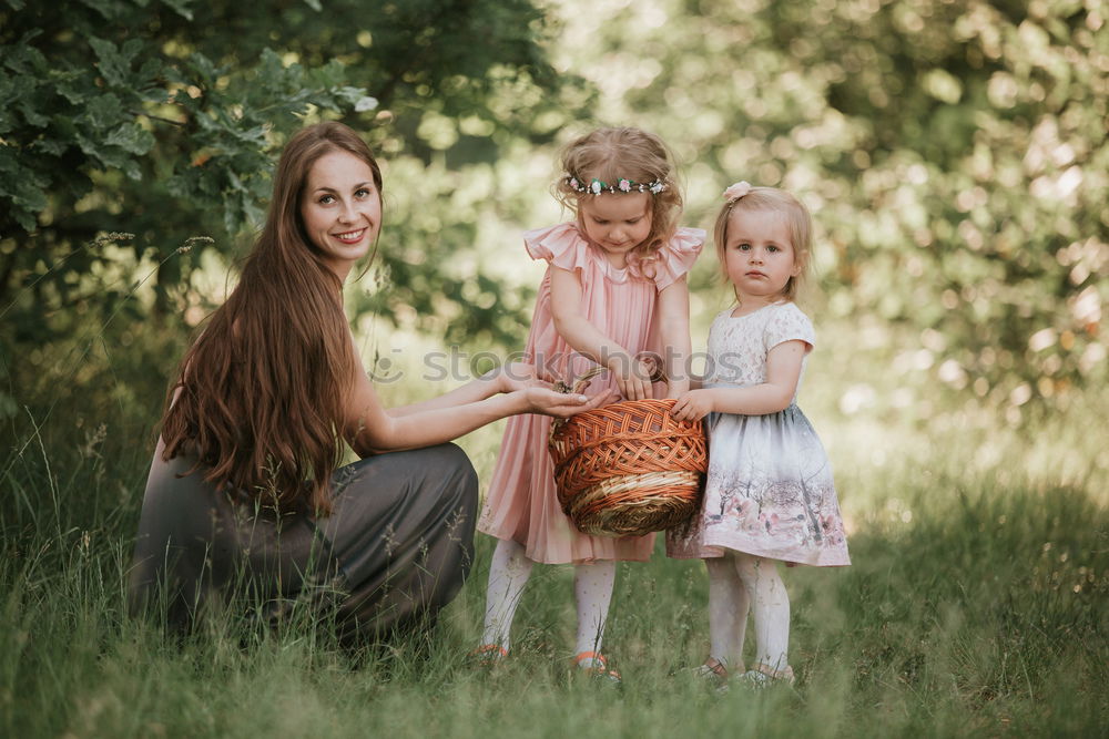 Similar – Grandmother with her grandchildren sitting in the field