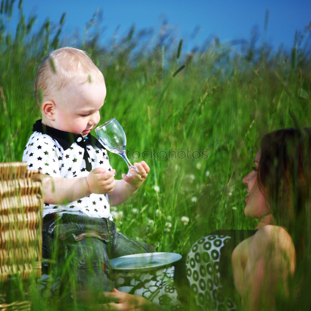 Similar – Image, Stock Photo Father showing grasshopper to children