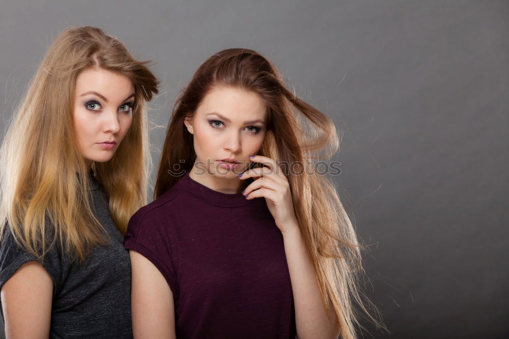 Similar – Two women embracing in studio