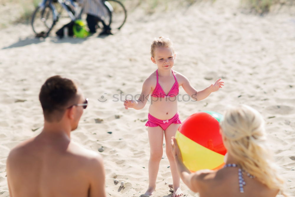 Similar – Image, Stock Photo Mother, father and little son on summer vacation at the seaside, They wearing snorkels and flippers while lying and playing on the beach