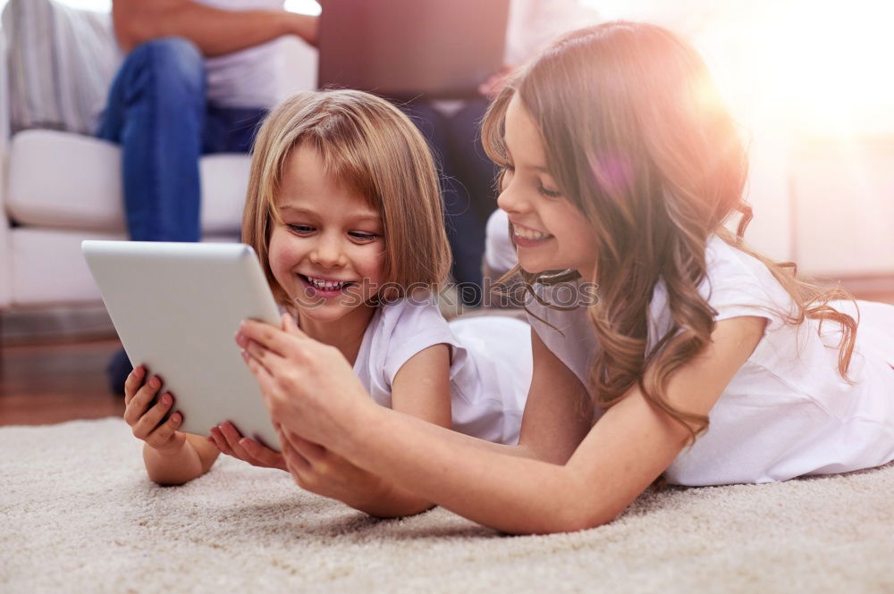 Similar – Young happy couple using smart phone sitting in the park