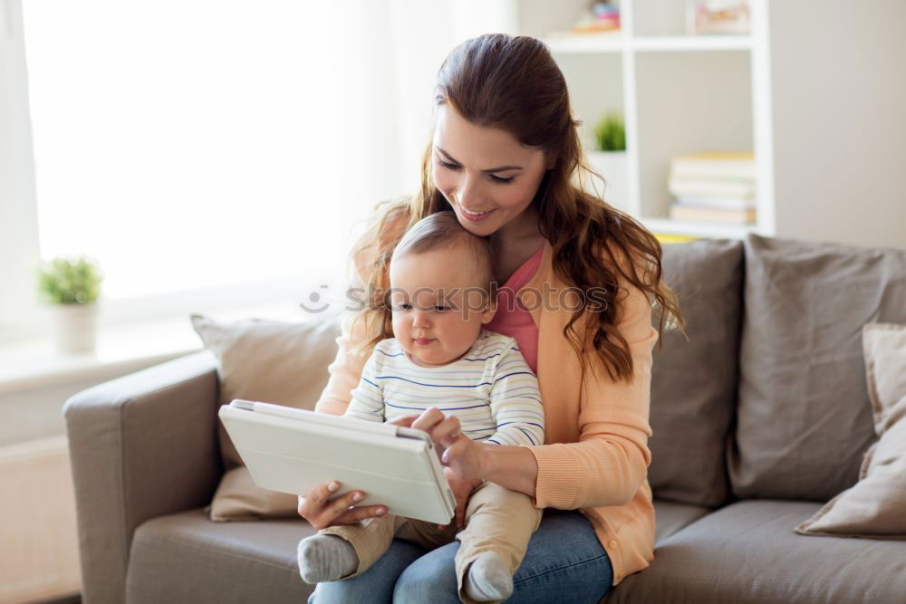 Similar – Mother breastfeed baby while playing with smartphone