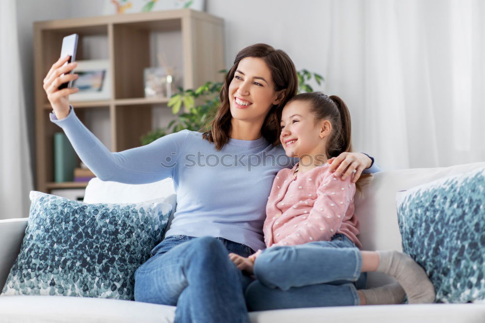 Similar – happy mother and toddler son using tablet