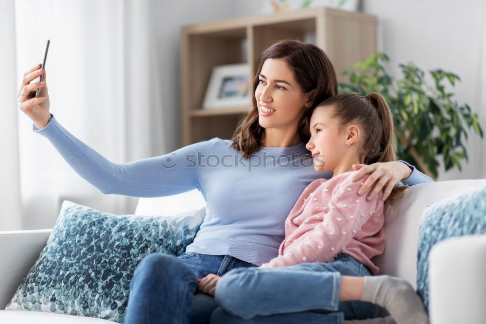 Similar – happy mother and toddler son using tablet