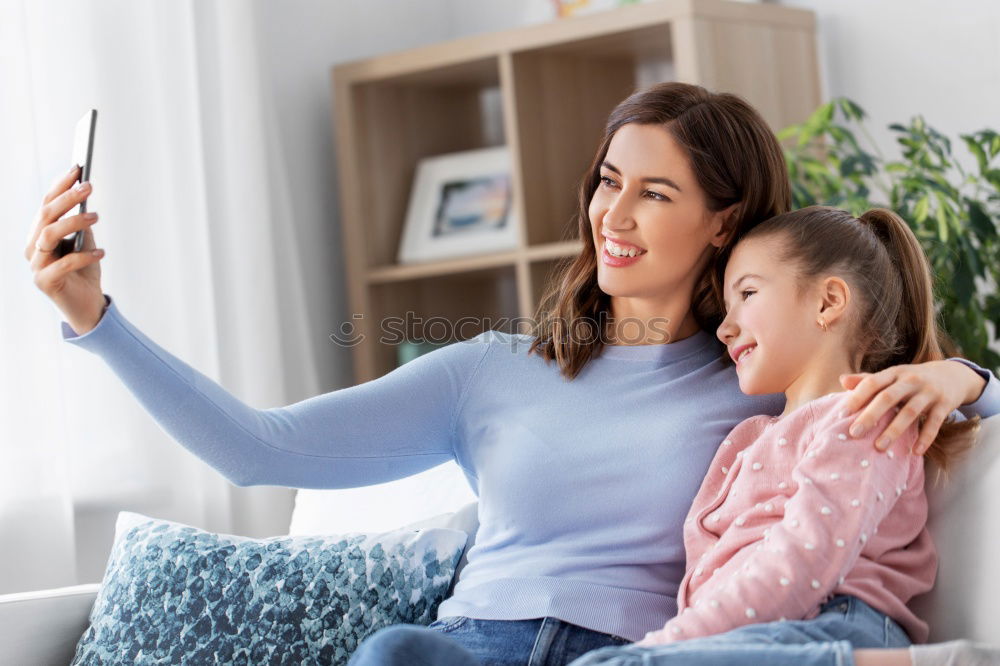 Similar – happy mother and toddler son using tablet