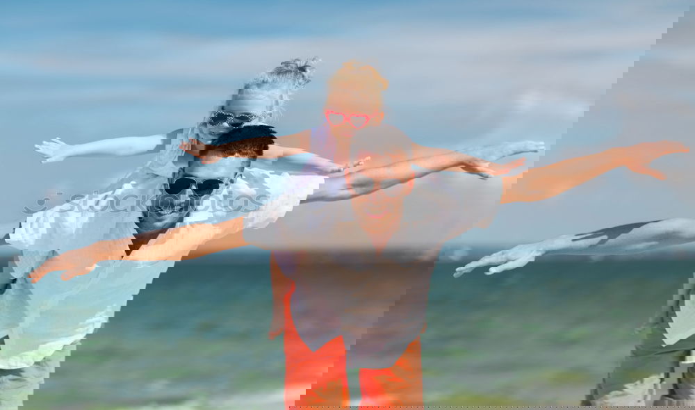 Similar – Image, Stock Photo Father and son playing on the beach at the day time.