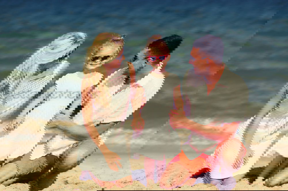 Similar – Image, Stock Photo Father and children sitting on the beach at the day time. Concept of happy friendly family.