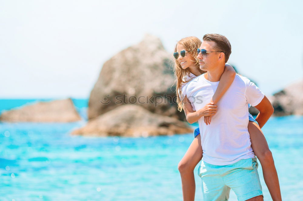 Image, Stock Photo Father and son playing on the beach at the day time. Concept of friendly family.