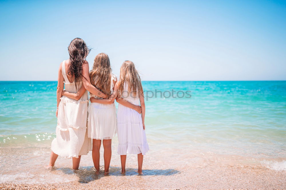 Similar – Image, Stock Photo Three happy children playing on the beach at the day time. Concept of summer vacation.