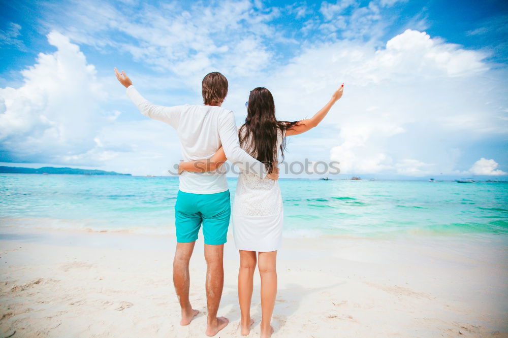 Similar – Father and daughter with balloons playing on the beach