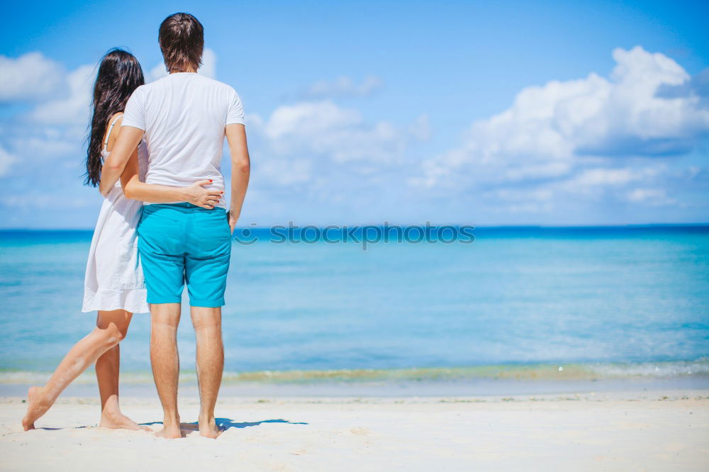 Similar – Father and daughter playing on the beach at the day time.