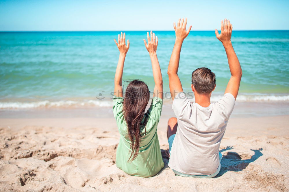 Similar – Father and daughter with balloons playing on the beach