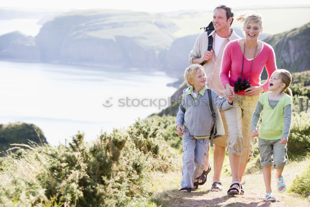 Similar – Image, Stock Photo Happy family standing near the lake at the day time.