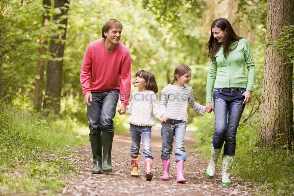 Similar – Image, Stock Photo Happy family walking together holding hands in the forest