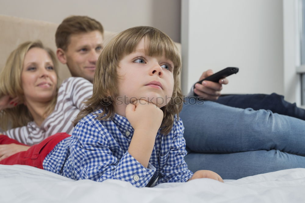 Similar – Three kids using a tablet at home