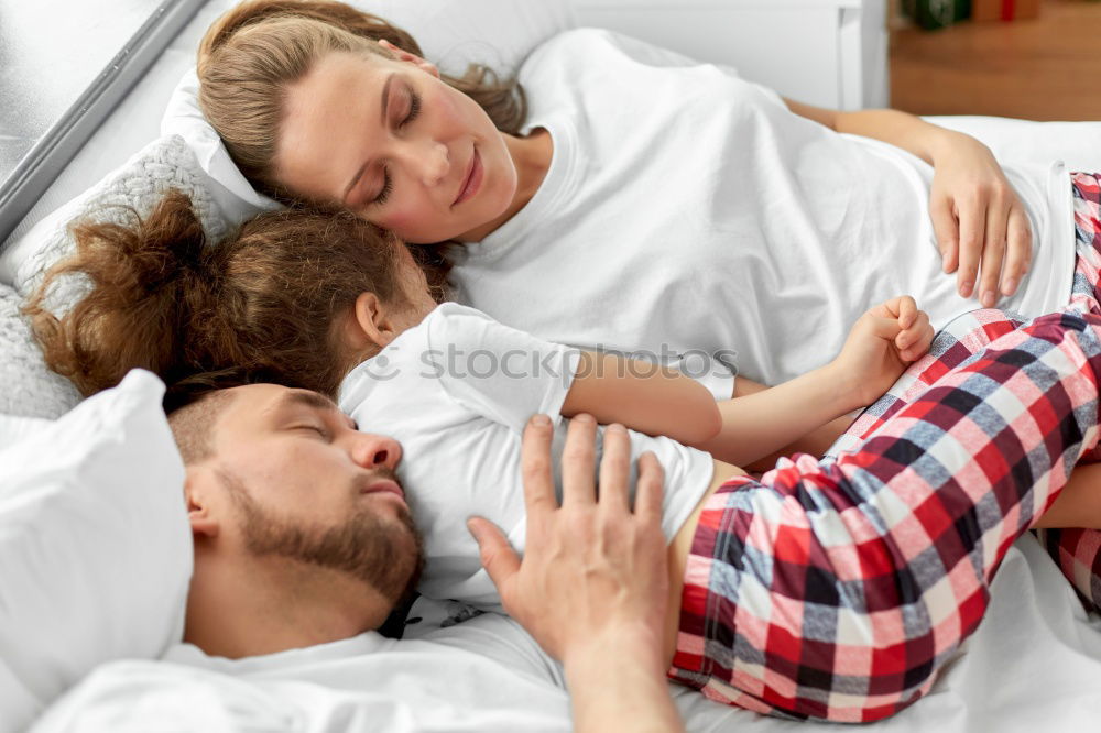 Similar – Brother and sister tickling and laughing on bed