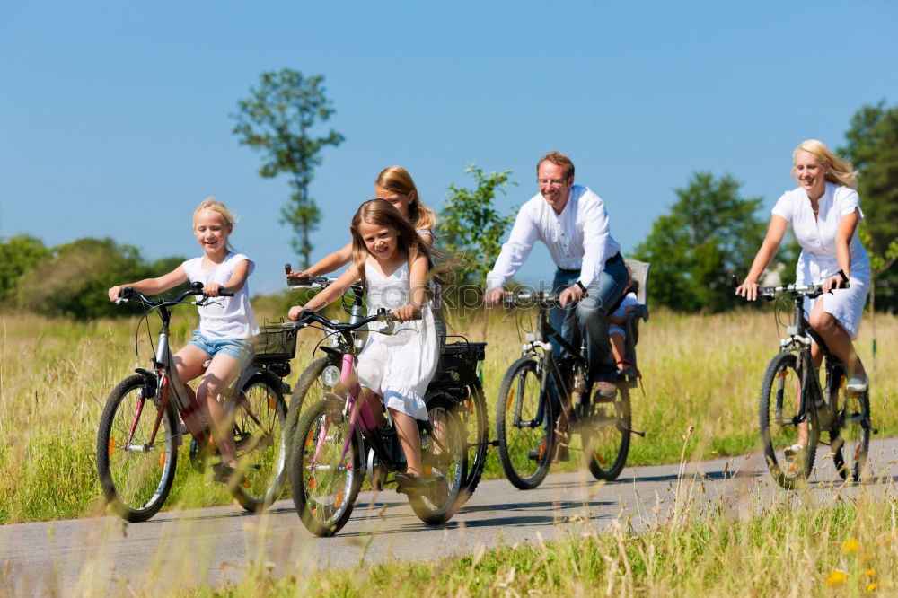 Similar – Image, Stock Photo Women on bikes giving high five