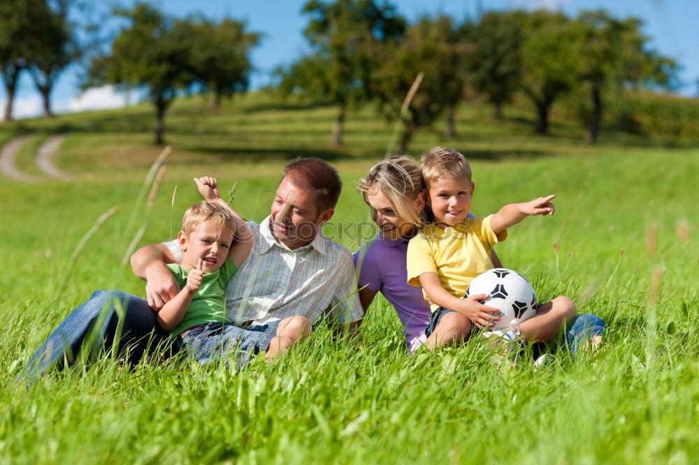 Similar – Three happy children playing in the park at the day time.