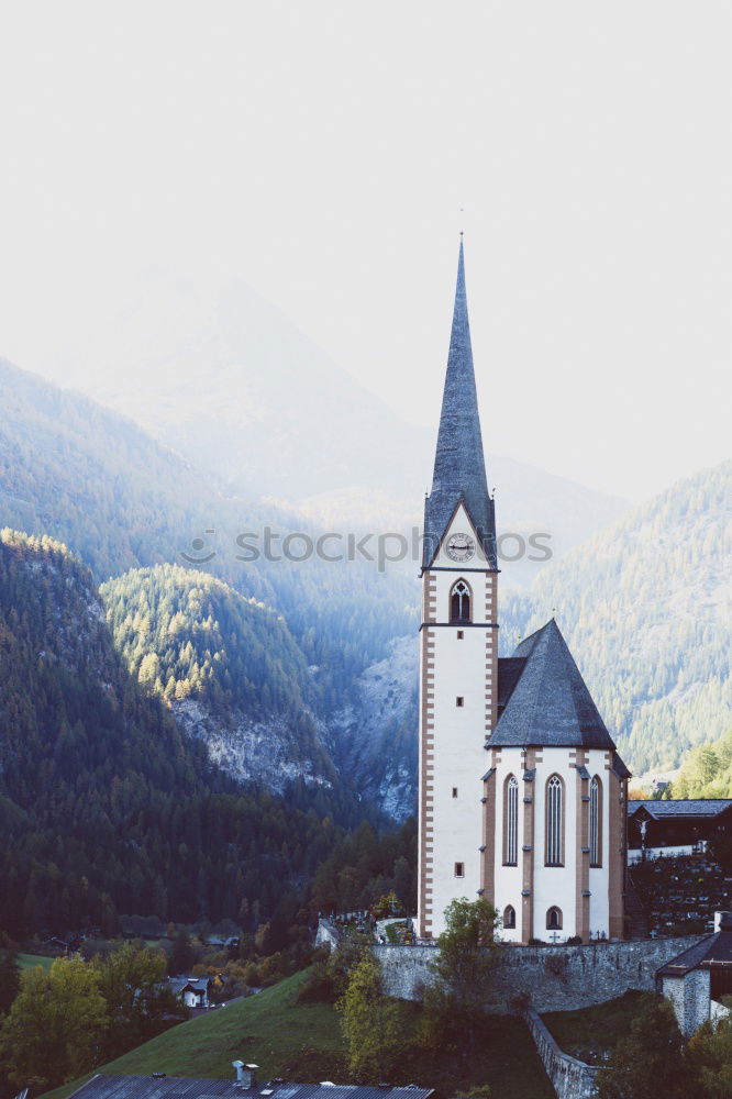 Similar – Church tower in front of foggy landscape