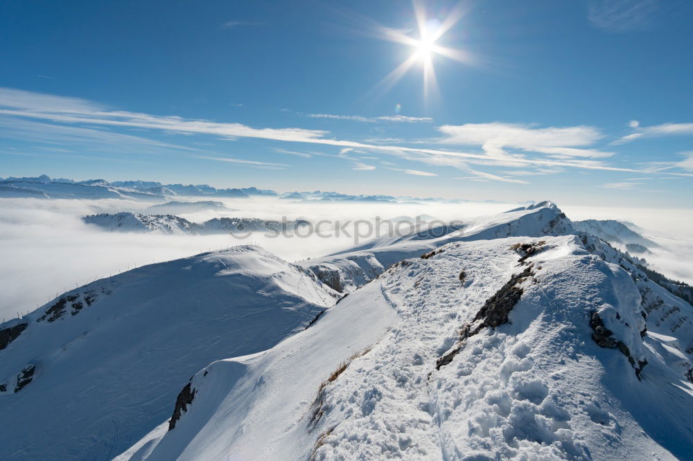 Similar – Image, Stock Photo Snowy blue mountains in clouds at sunset