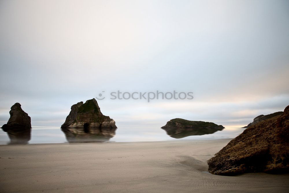 Similar – Image, Stock Photo Big chunk. Huge rock lies in the Pacific surf. Queensland. Australia. In the background very small : skyscrapers.