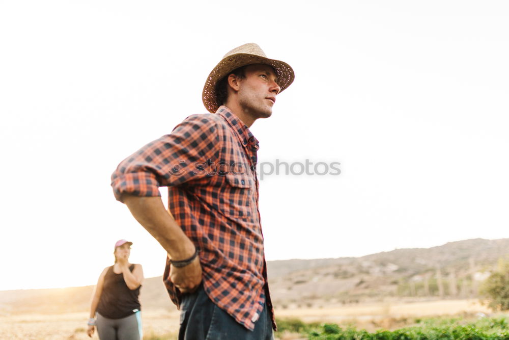 Similar – Bearded man in hat against sunlight