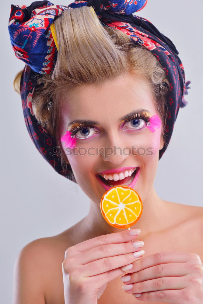 Similar – Image, Stock Photo Young woman holding colorful lollipops