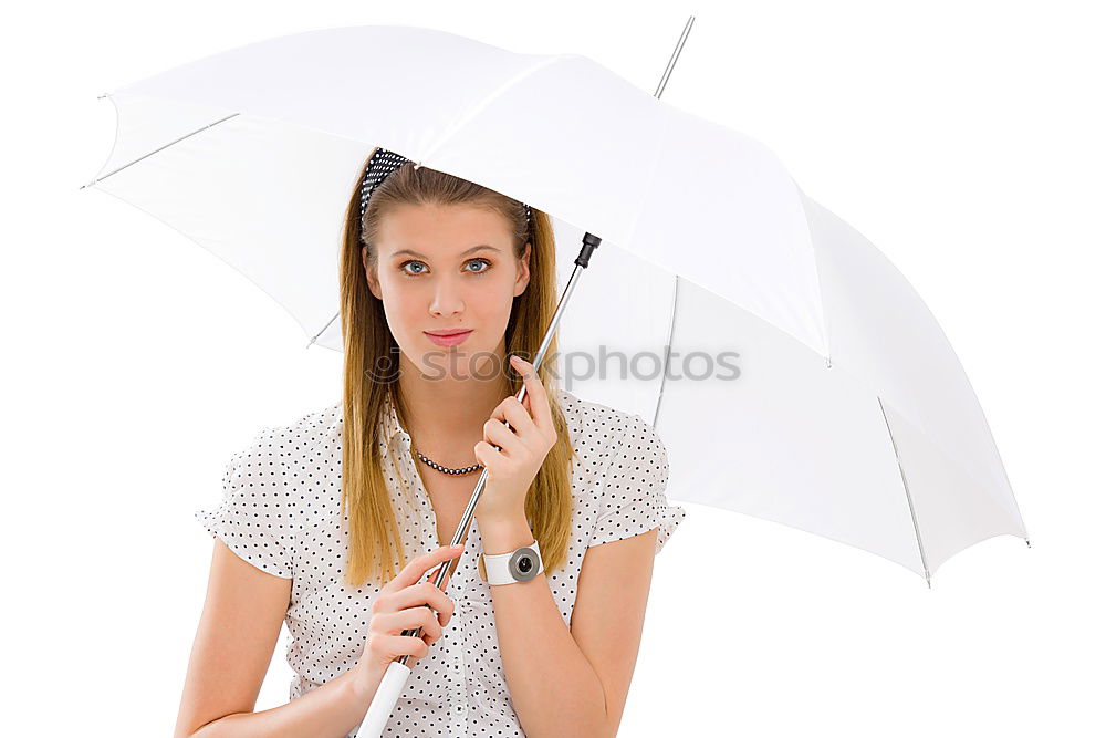 Similar – Woman with umbrella in front of green wall