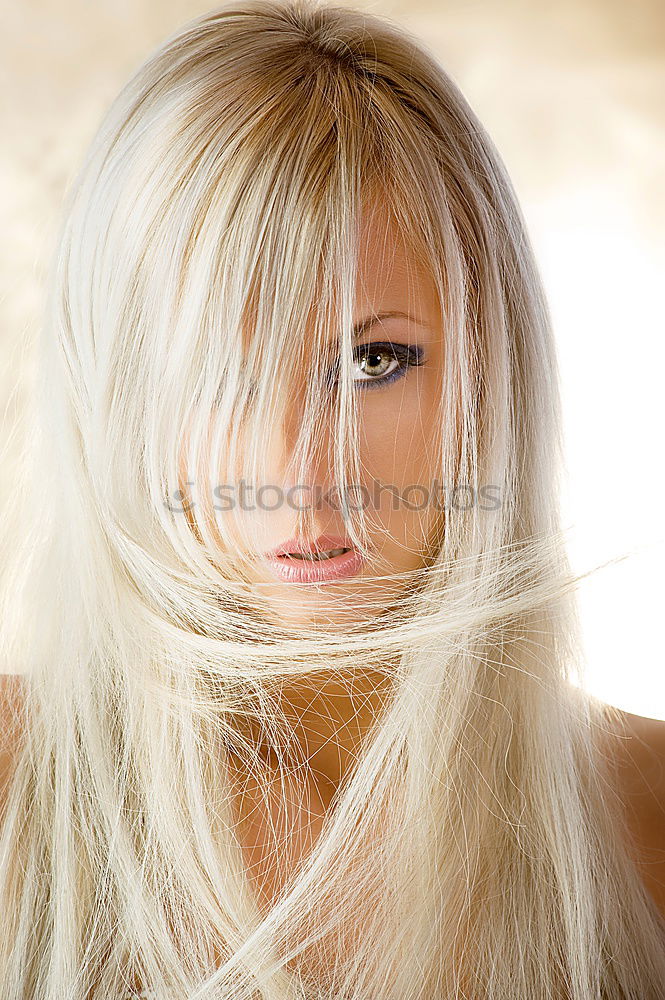 Similar – Profile shot of blonde long haired young woman with light eyes