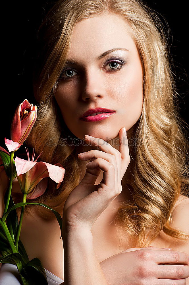 Similar – Pretty woman standing with white flowers