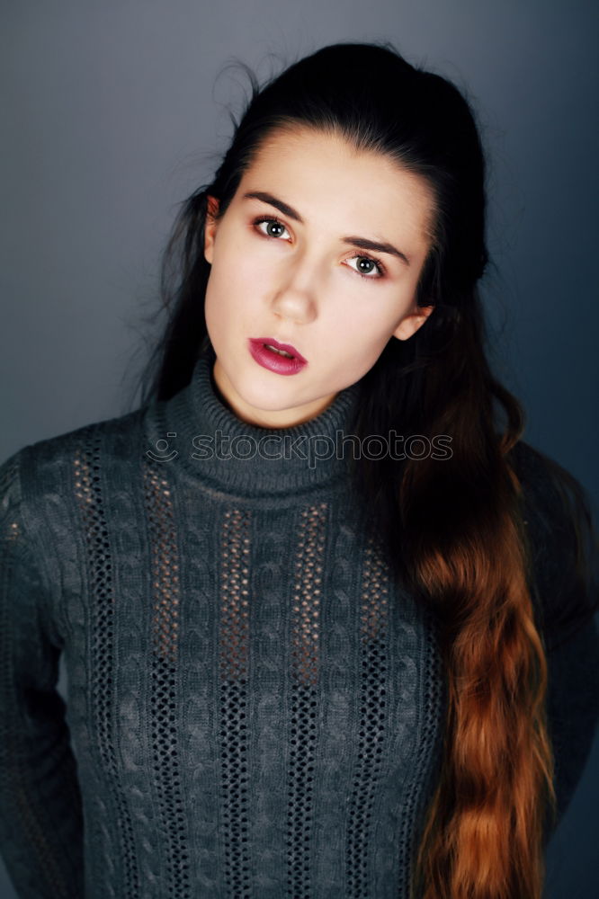 Similar – Portrait of a young teenager girl standing looking throughout the window