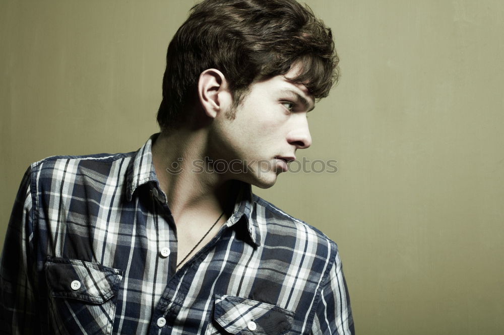 Similar – Young man sitting on the floor in urban background