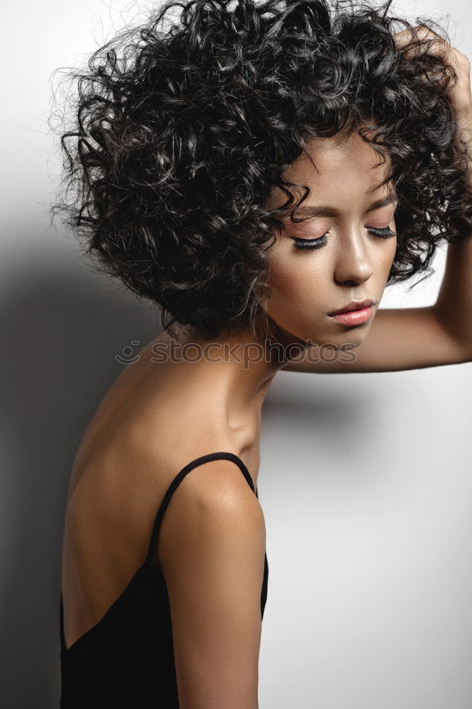 Similar – Portrait of attractive afro woman using mobile phone in the street