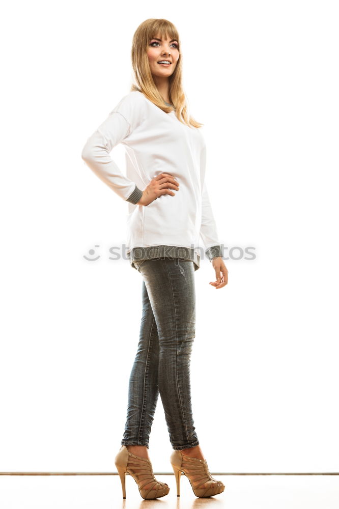 Similar – Elegant businesswoman looking at camera while sitting on stairs against of white wall