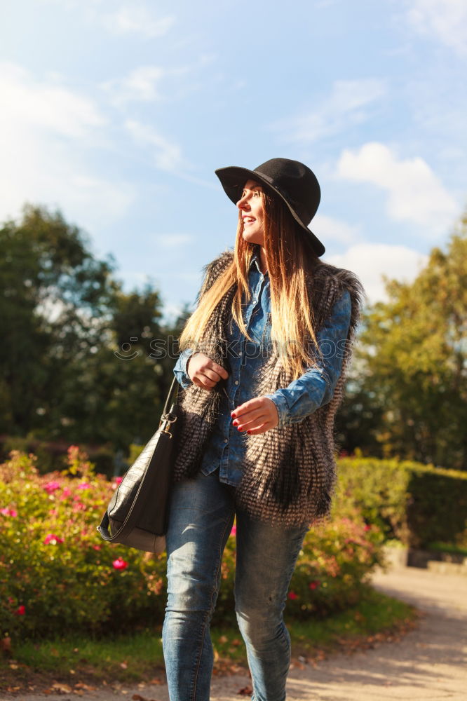 Similar – Image, Stock Photo Cheerful stylish woman in hat