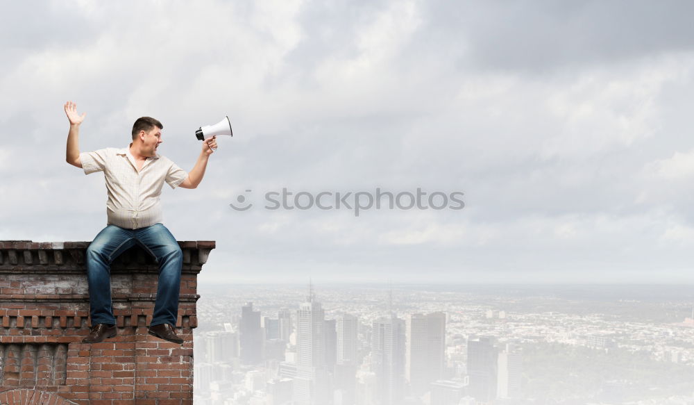 Similar – Two businessmen shaking hands in the air