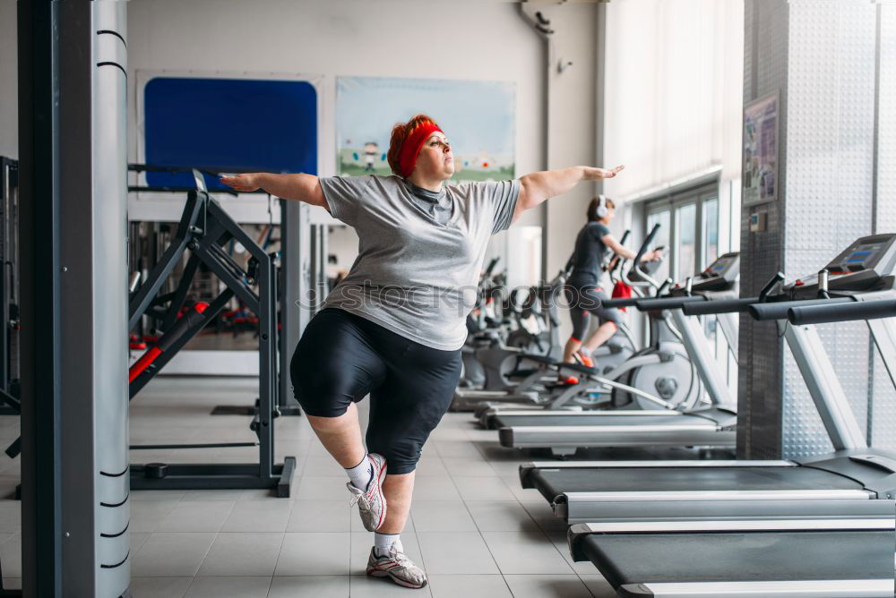 Similar – Image, Stock Photo Couple doing exercises over steps in fitness center