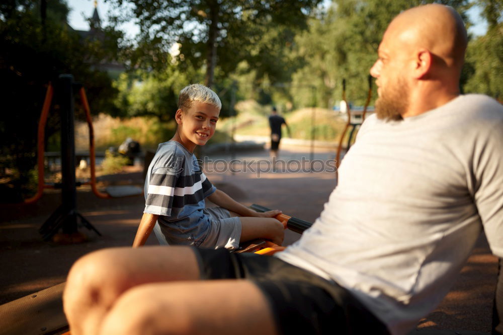 Similar – Foto Bild Oma spielt mit ihrem Enkel im Kinderwagen im Garten.