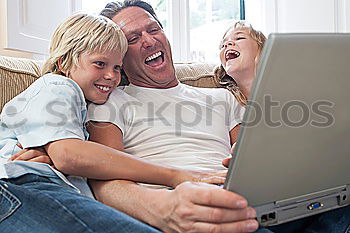 Similar – Happy family in a urban park playing with tablet computer