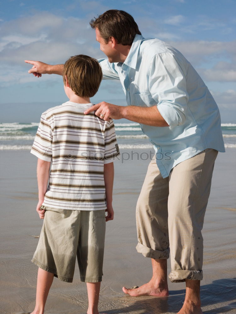 Similar – Image, Stock Photo Father and son standing on the road at the day time. Concept of tourism.