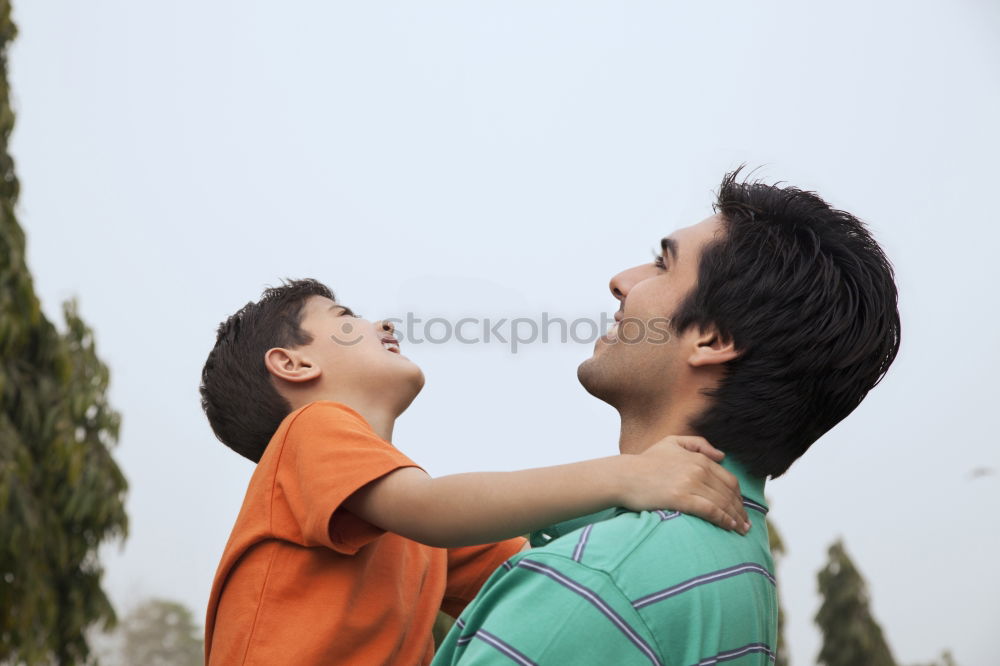 Similar – Image, Stock Photo Father and son walking on the road at the day time. People having fun outdoors. Concept of friendly family.