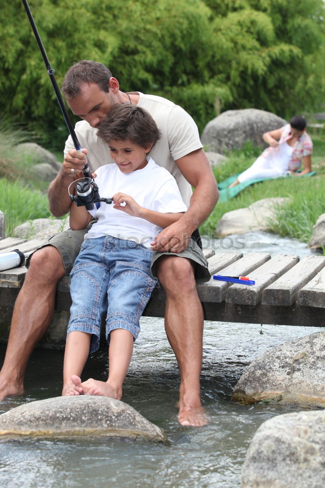 Similar – Image, Stock Photo Young boy and his little sister sitting on jetty over the lake and dipping feet in water on sunny day in the summertime