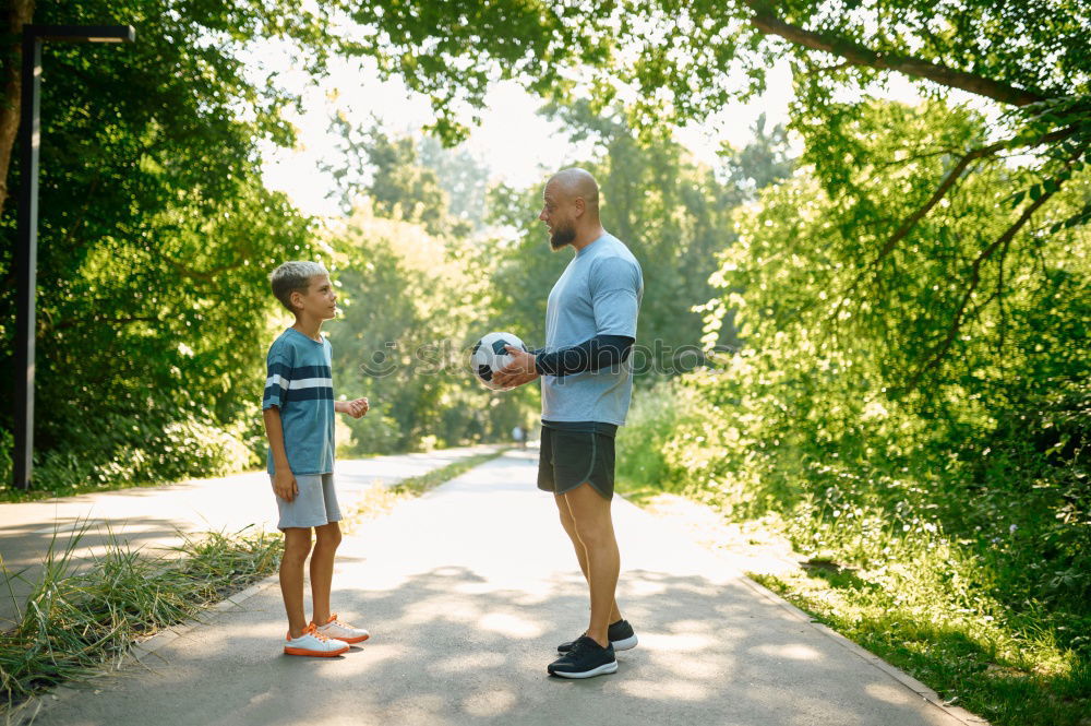 Similar – Happy family walking together holding hands in the forest